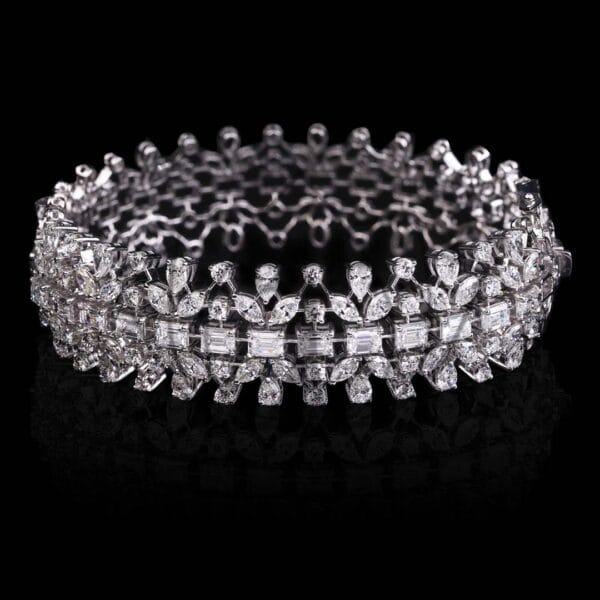 Sparkling dream diamond bracelet with emerald cut, marquise, pear, and round shape diamonds.