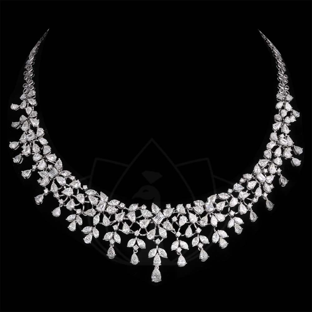 Breathtaking stunner diamond necklace with solitaire fancy shape diamonds.