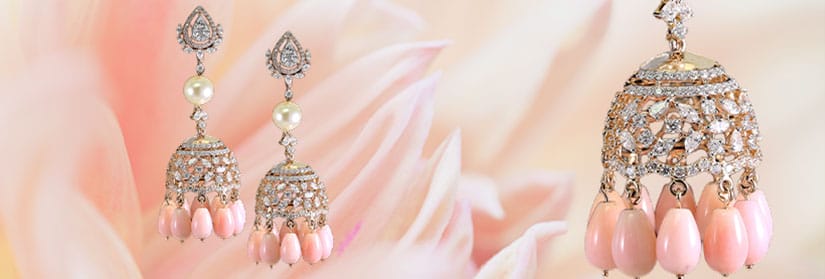 Sparkling diamond earrings with white and pink pearls.