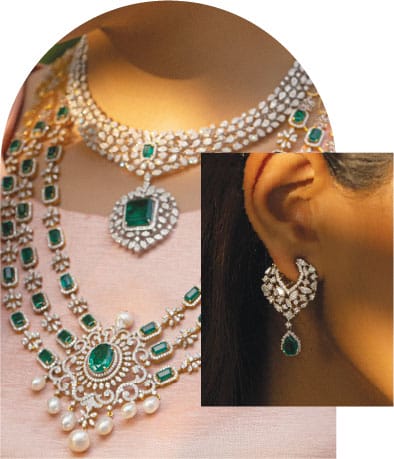 A modern bride wearing make a wish customized diamond layered necklaces, and earrings with green gemstones.