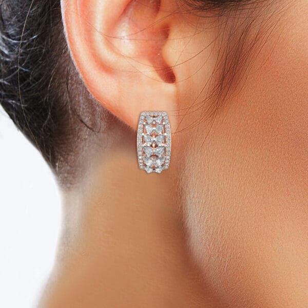 Human wearing the Clasping Charisma Diamond Earrings