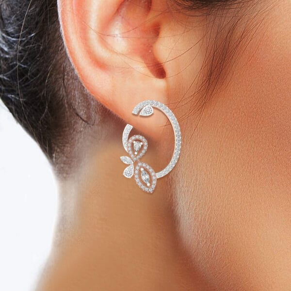 Human wearing the Comely Curves Diamond Earrings