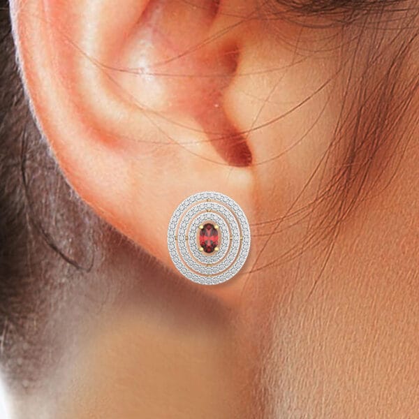 Human wearing the Concentric Carmine Diamond Earrings