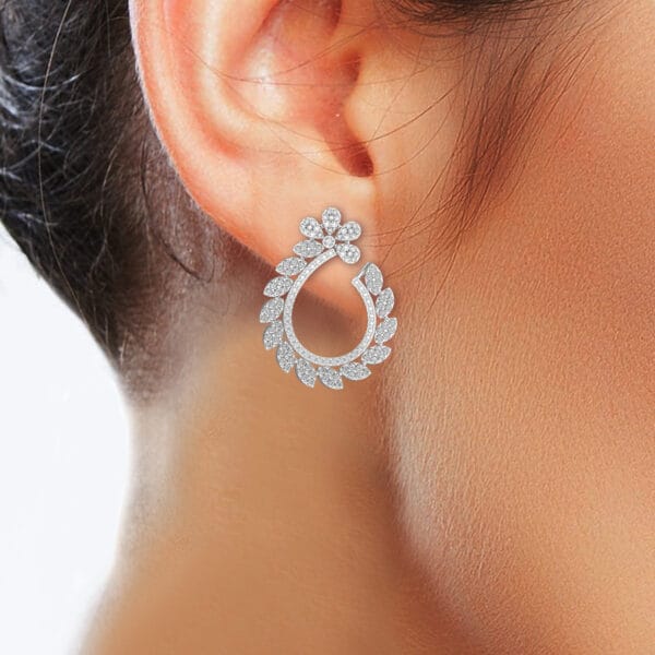Human wearing the Curling Coruscations Diamond Earrings