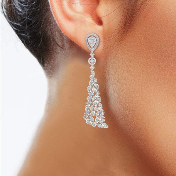 Human wearing the Ornate Outshine Diamond Earrings