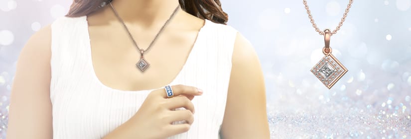 A female model with white top is wearing a necklace with solitaire pendant and a Diamond ring.