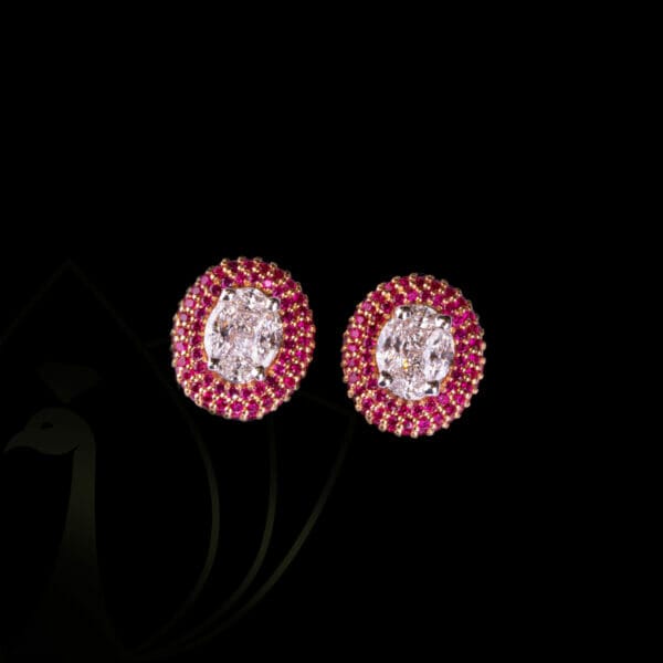 Ornate beauty diamond earrings with glittering diamonds and vibrant red hue stones.