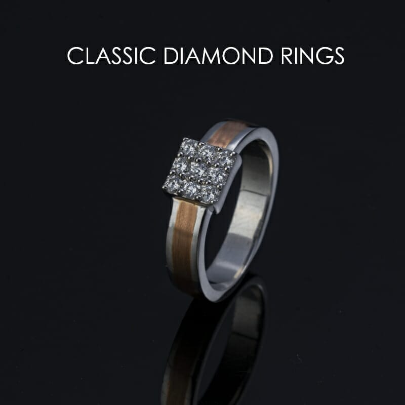 Classic diamond-studded platinum and gold band ring for men from the Pache collection.
